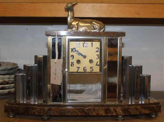 A.H. Decoux. An Art Deco silvered bronze and marble mantel clock, 14in.(-)